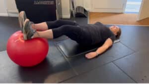Nell doing bridges with BFR cuffs around her thighs